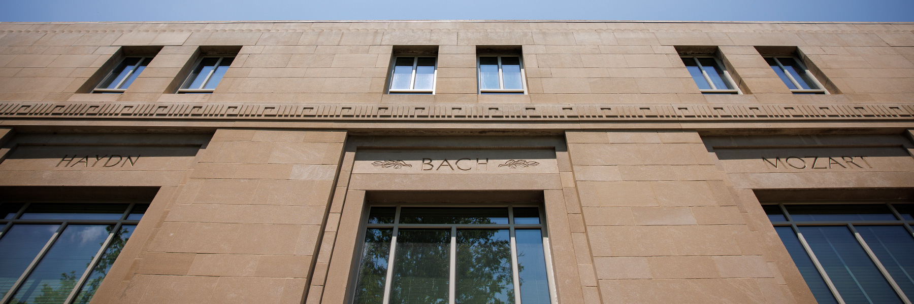 A  building on the IU Bloomington campus with engravings for Haydn, Bach, and Mozart.