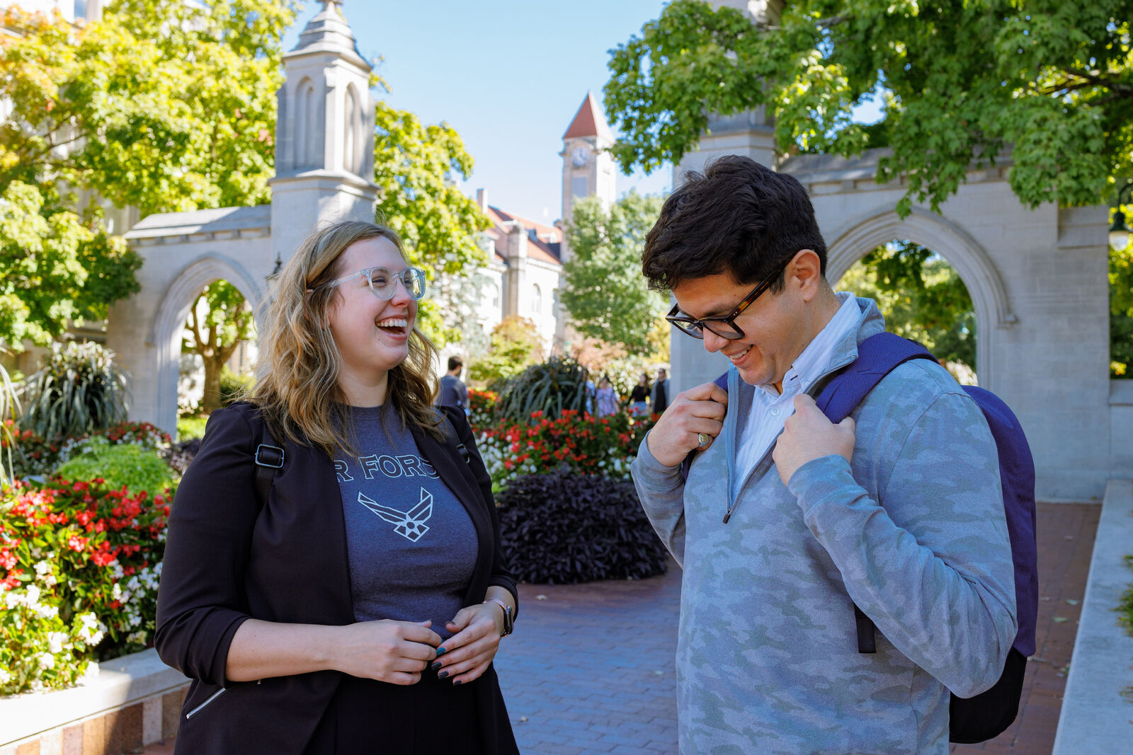 Students having a conversation outside the IU Bloomington Sample Gates